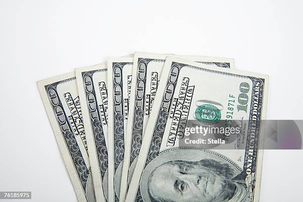 a fan of hundred dollar bills - 100 dollars stockfoto's en -beelden