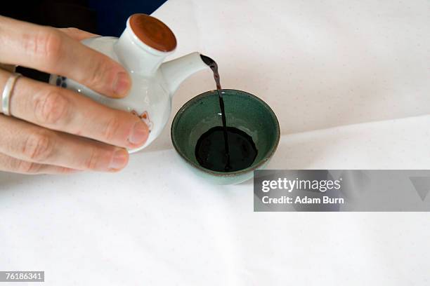 pouring soy sauce - soy sauce stock pictures, royalty-free photos & images
