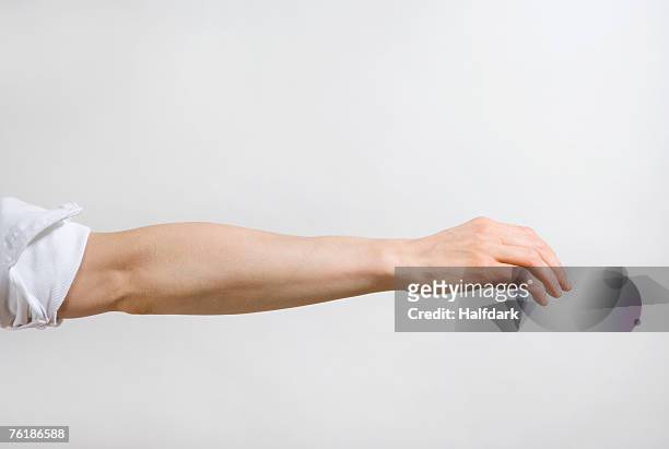 detail of a man's arm outstretched - braccio umano foto e immagini stock