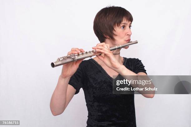 a female flautist - classical musician stock pictures, royalty-free photos & images