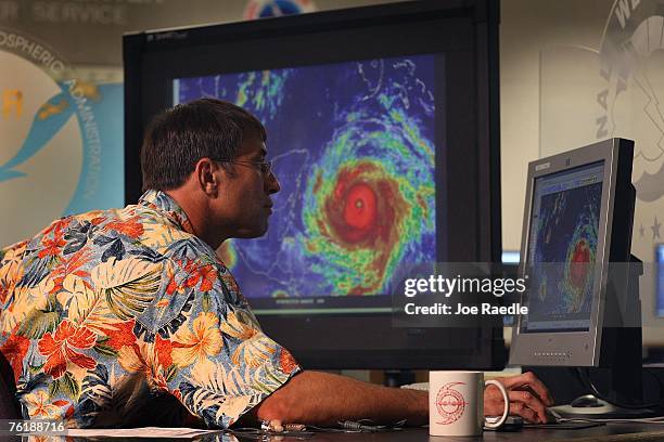 Meteorologist Chris Landsea with the National Hurricane Center keeps an eye on Hurricane Dean as it passes through the Caribbean August 20, 2007 in...