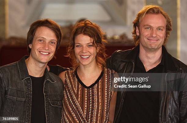 Actress Jessica Schwarz, actor August Diehl and actor Mark Waschke pose at a photocall for "Buddenbrooks" on August 20, 2007 in Luebeck, Germany.