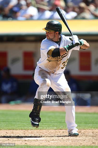 Nick Swisher of the Oakland Athletics bats during the game against the Kansas City Royals at McAfee Coliseum in Oakland, California on August 19,...