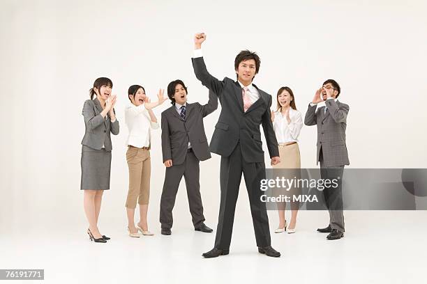 business people cheering - 応援　日本人 ストックフォトと画像