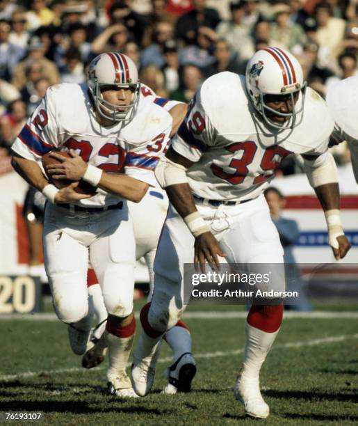 New England Patriots running back Andy Johnson carries the football and runs behind the blocking of running back Sam Cunningham during the Patriots...