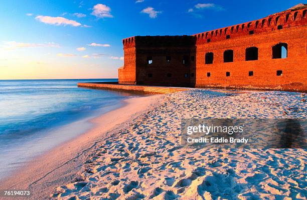 fort jefferson and beach at sunset, garden key, dry tortugas national park, florida, united states of america, north america - citadel v florida stock pictures, royalty-free photos & images