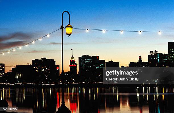 lake merritt with lights at sunset with city in background, oakland, california, united states of america, north america - oakland california night stock pictures, royalty-free photos & images