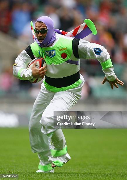 Fan dressed as "Buzz Lightyear" invades the pitch and grabs the match ball during the Middlesex Sevens at Twickenham on August 18, 2007 in London,...