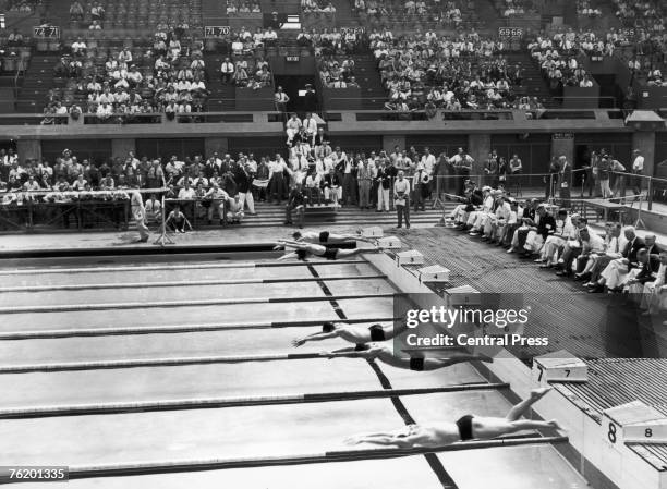 The start of the 5th heat of the Men's 100-Metres Freestyle event at the Empire Pool, Wembley during the London Olympics, 30th July 1948. The winner...