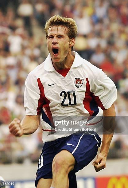 Brian McBride of the USA celebrates scoring the third goal against Portugal during the first half during the Portugal v USA, Group D, World Cup Group...