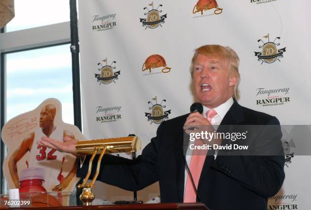 Donald Trump speaks with golfers participating in the 4th annual Alonzo Mourning Charity Golf tournament on August 20, 2007 at the Trump National...