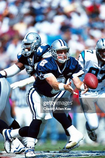 Quarterback Troy Aikman of the Dallas Cowboys gets ready to hand the ball off in a 16 to 13 win over the Carolina Panthers on .