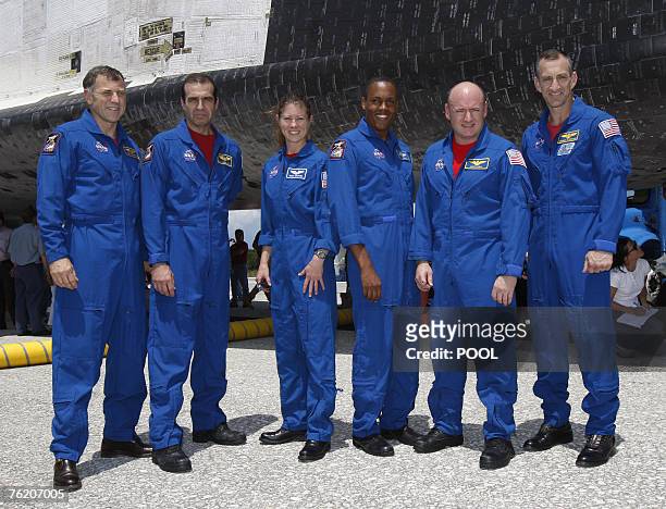 Crew of the space shuttle Endeavour pose by the spacecraft after it landed, 21 August 2007, at Kennedy Space Center, Florida. From left- Canadian...