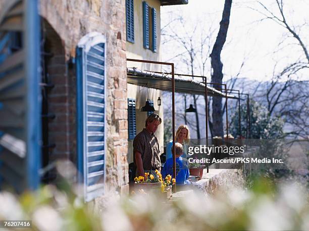 family on terrace of villa, livorno, tuscany, italy, europe - tuscan villa stock pictures, royalty-free photos & images