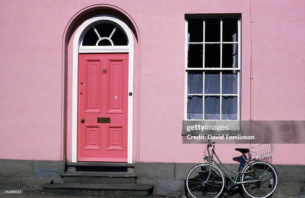 Bicycle leaning against pink house, Oxford, Oxfordshire, England, United Kingdom, Europe