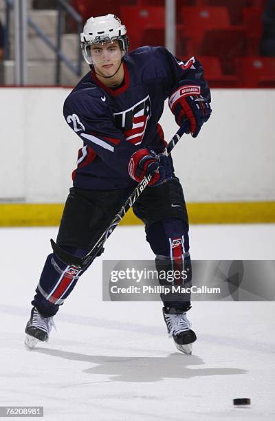 Kevin Shattenkirk of Team USA Blue passes the puck against Team Finland during an exhibition game on August 7, 2007 at the 1980 Rink Herb Brooks...