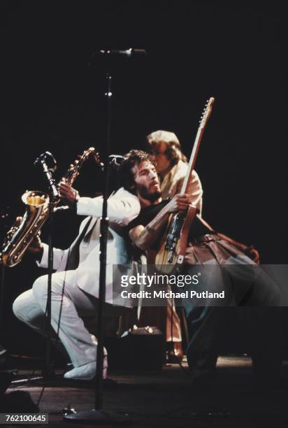 American musician Bruce Springsteen performs live on stage with saxophone player Clarence Clemons of the E Street Band at Hammersmith Odeon in London...