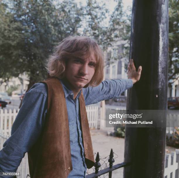 American guitarist Joe Walsh of The James Gang, and later The Eagles, posed wearing a suede waistcoat standing in a doorway in London on 20th October...