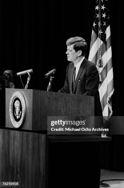 President John F. Kennedy listens to a question during a press conference on April 14 in Washington, DC. This press conference took place three days...