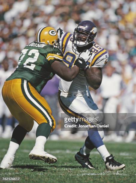 Fernando Smith, Defensive End for the Minnesota Vikings in contact with Earl Dotson, Offensive Tackle for the Minnesota Vikings during their National...
