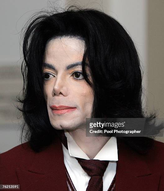 Michael Jackson re-enters the courtroom during a break at the Santa Barbara County courthouse April 27 in Santa Maria, California at his child...