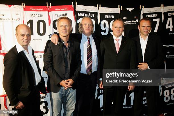 Corny Littmann, TV host Reinhold Beckmann, Christian Hinzpeter, Jens O. Geldmacher and Bernd Hoffmann pose during the press conference of the...