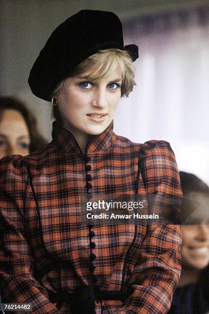 Diana, Princess of Wales, wearing a tartan dress designed by Caroline Charles and a black Tam o' shanter style hat, attends the Braemar Highland...
