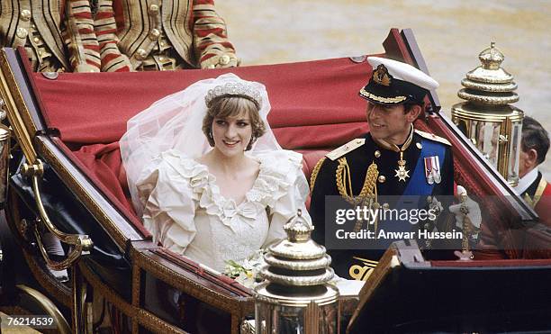 Prince Charles, Prince of Wales and Diana, Princess of Wales, wearing a wedding dress designed by David and Elizabeth Emanuel and the Spencer family...