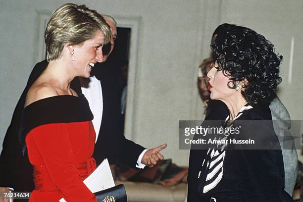 Diana, Princess of Wales meets Joan Collins at a charity performance of 'Private Lives' at the Aldwych Theatre in aid of the Royal Marsden Hospital's...