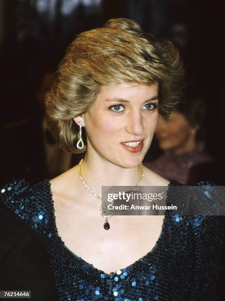 Diana, Princess of Wales, wearing a sea green sequined dress designed by Catherine Walker, attends a gala performance of 'Love For Love' at the...