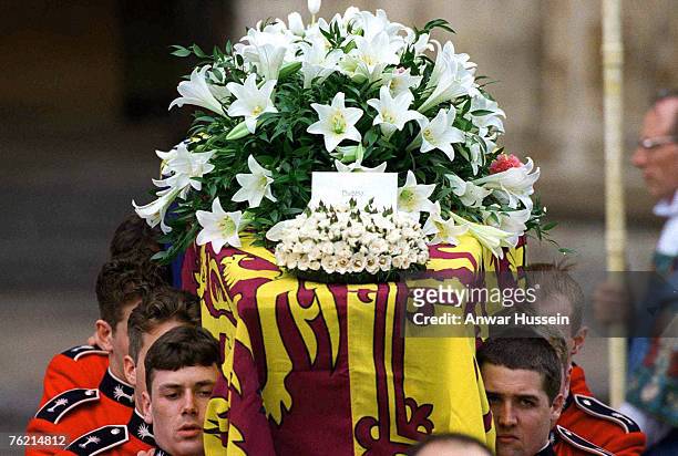 The coffin of Princess Diana, Princess of Wales, leaves Westminster Abbey after the funeral service on September 6, 1997. The touching flral tribute...