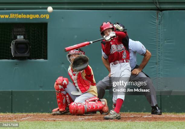 Patrick Hayes Jr. #9 of the New England team from Walpole, Massachusetts connects for a third inning double against the Southeast team from Warner...