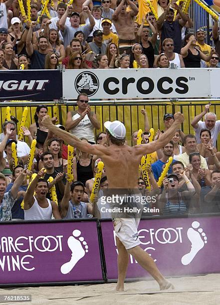 Stein Metzger celebrates after scoring during the men's finals against Brad Keenan and John Hyden in the AVP Chicago Open in North Avenue Beach on...