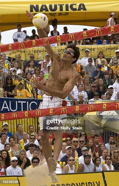 Mike Lambert hits the ball during the men's finals against Brad Keenan and John Hyden in the AVP Chicago Open in North Avenue Beach on August 4, 2007...
