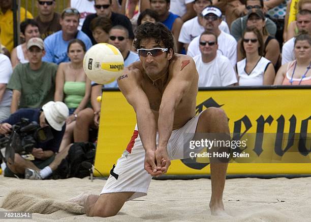 Mike Lambert digs the ball during the men's finals against Brad Keenan and John Hyden in the AVP Chicago Open in North Avenue Beach on August 4, 2007...