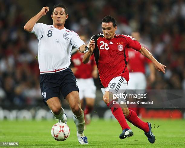 Piotr Trochowski of Germany challenges Frank Lampard of England during the international friendly match between England and Germany at Wembley...