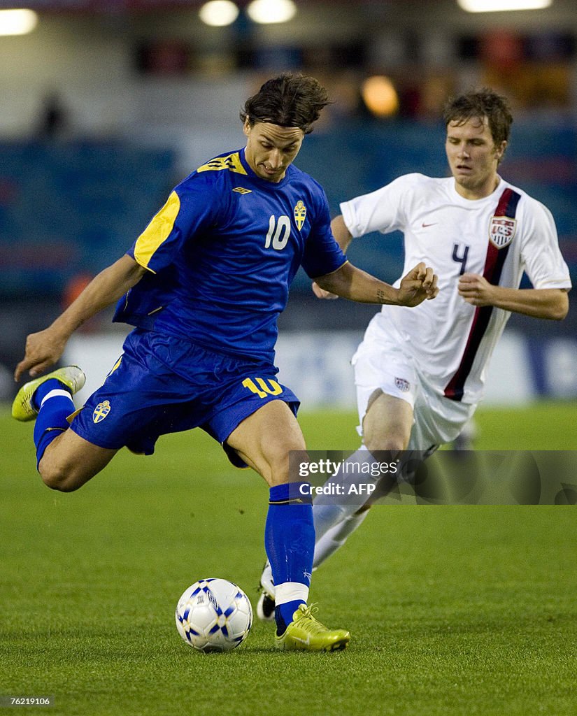 Sweden's Zlatan Ibrahimovic (L) is chase