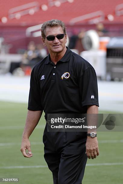 Former quarterback Joe Theismann walks the field prior to a preseason game on August 18, 2007 between the Pittsburgh Steelers and the Washington...