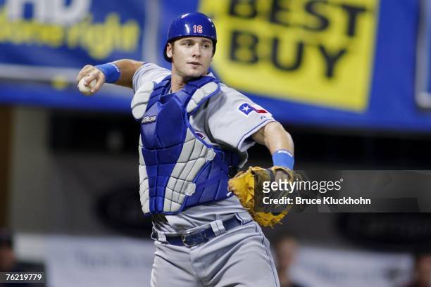Jarrod Saltalamacchia of the Texas Rangers throws the ball in a game against the Minnesota Twins at the Humphrey Metrodome in Minneapolis, Minnesota...