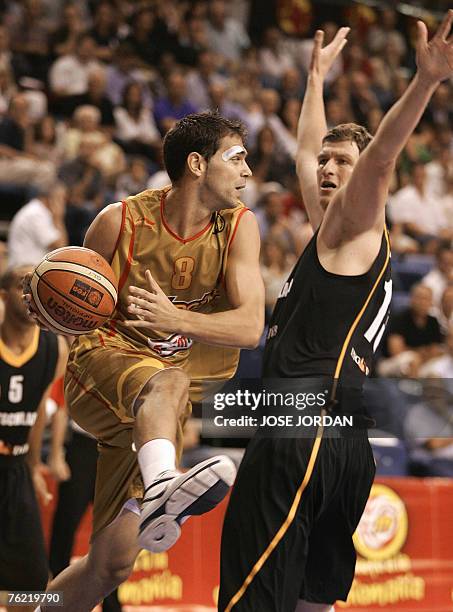 Spain's player Jose Manuel Calderon vies for the ball with German Patrick Femerling during their friendly match at the Fuente San Luis Sports Palace...
