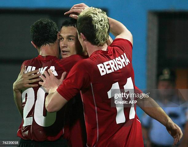 Albania's Devi Muka Hamdi Salihi and Besart Berisha celebrate as Salihi scored 1-0 against Malta, during a friendly football match, 22 August 2007 in...