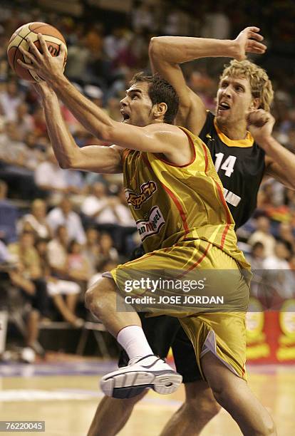 Spain,s player Jose Manuel Calderon vies for the ball with German Dirk Nowitzki during their friendly match at the Fuente San Luis Sports Palace in...