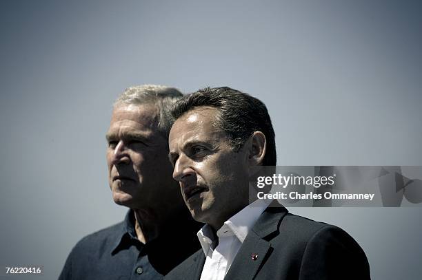 United States President George W. Bush greets French President Nicolas Sarkozy on August 11, 2007 at the Bush family seaside compound at Walker's...