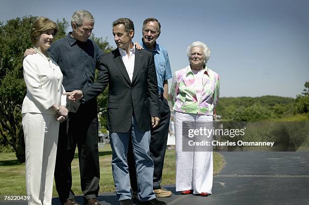 Former US president George H.W. Bush greets French President Nicolas Sarkozy as his wife Barbara and US President George W. Bush and First Lady Laura...