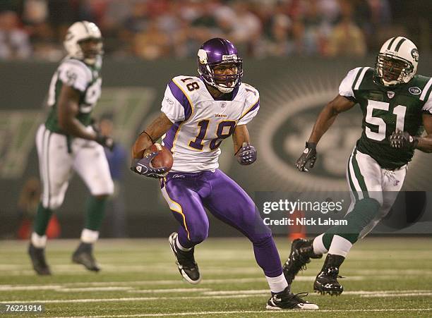 Sidney Rice of the Minnesota Vikings carries the ball against Jonathan Vilma of the New York Jets during their preseason game on August 17, 2007 at...
