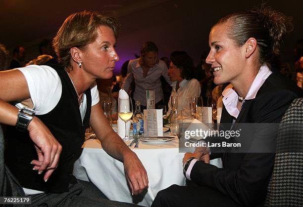 Martina Voss speaks with Simone Laudehr during the 25th Anniversary Gala of Women's German National Team at the Oberwerth stadium on August 22, 2007...