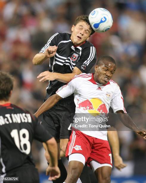 Marc Burch of DC United heads the ball away from Dane Richards of the New York Redbulls on August 22, 2007 at RFK stadium in Washington, DC.