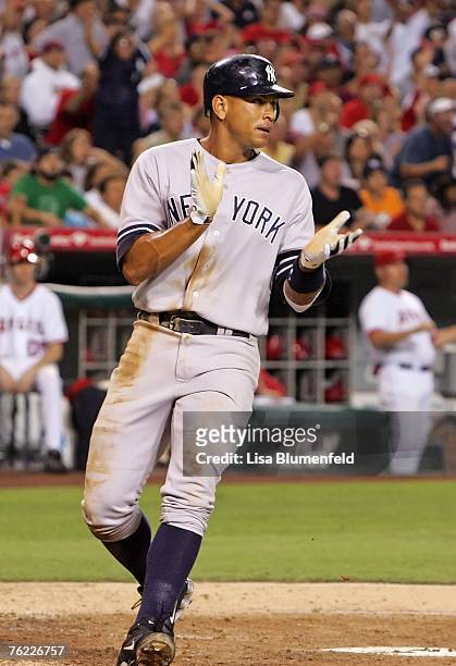 Alex Rodriguez of the New York Yankees scores in the fourth inning against the Los Angeles Angels of Anaheim at Angels Stadium on August 22, 2007 in...