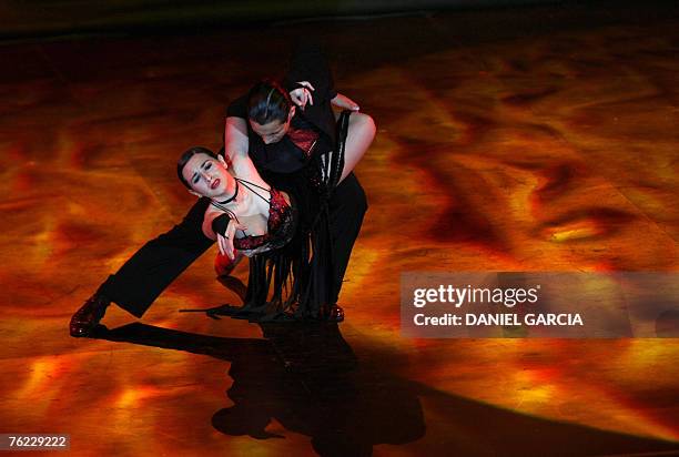 Argentine couple Pablo Contreras and Cynthia Palacios dance during the semifinals of the Stage Tango competition in Buenos Aires, 22 August 2007. The...