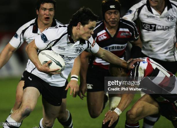 Zac Guildford of Hawkes Bay fends off Tanner Vili of Counties Manukau during the Air New Zealand Cup match between Counties Manukau and Hawkes Bay at...